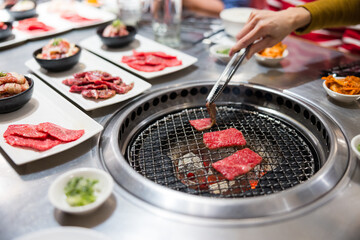 Delicious yakiniku beef slices cooking on the grill