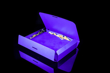 Best gift for men. Man gift concept. Blue open gift box on black background. Copy space for your text. Valentine's day, wedding, birthday and special occasion gift concept. Copy space for text.