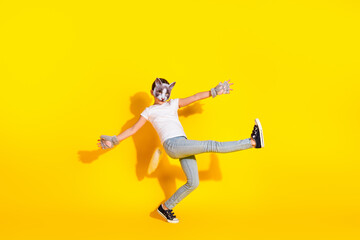 Young girl in casual fashion cat-inspired disguise with yellow background, showcasing quadrobists subculture character