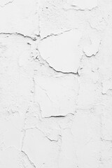 Obraz premium Close-up shot of a worn-out white wall with flakes of paint falling off