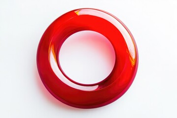 A red object placed on a white background