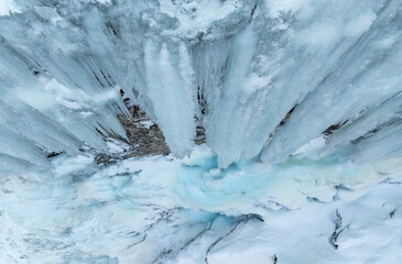 Waterfall that has turned to ice in the mountain. Drone photo from Norway.