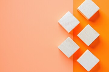 Fototapeta premium Simple Wooden Blocks on Orange and Peach Background for Creative Design Projects