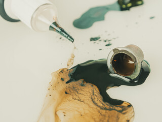 Close-up of tattoo inks in jars showing off bright colors, ready to be used to create tattoos.