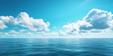 Obraz premium A stunning blue ocean landscape meets the sky, capturing the serene beauty of blue ocean water as it harmonizes with the expansive sky, showcasing nature s vibrant colors and tranquility.