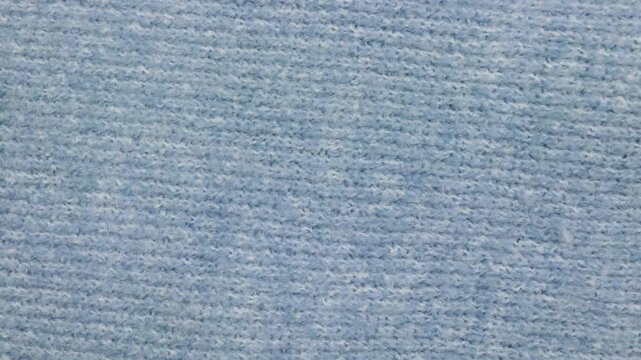 Texture du laine. Fond de couleur bleu clair