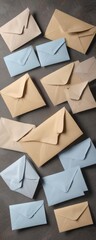 A group of envelopes in various sizes and colors on a textured background, mockup, office supplies, mail