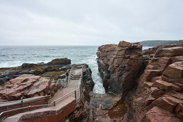Thunder hole is a popular place to visit in Acadia National Park, It is narrow inlet into the coast, that makes a loud noise when the waves crash into it. 