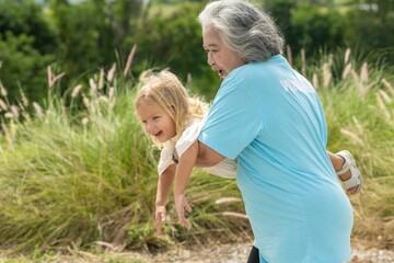 Fototapeta premium Woman is holding a small child in her arms
