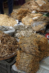 Closeup shot of mixed dried fish in a seafood market, Salted dried fish being sold at an Asian fish...