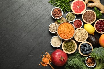 Superfood. Different healthy food products on grey table, flat lay. Space for text