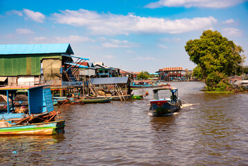 Floating village in Cambodia with traditional wooden houses