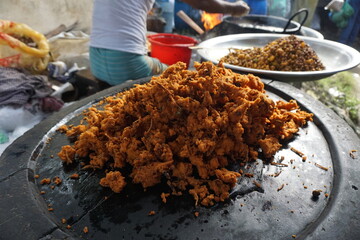 Mix vegetable pakora making and being displayed by a street food vendor, Crispy onion and potato pakoda selling on a market, Spicy veg pakora or pakoda displayed on a rural fair for sale