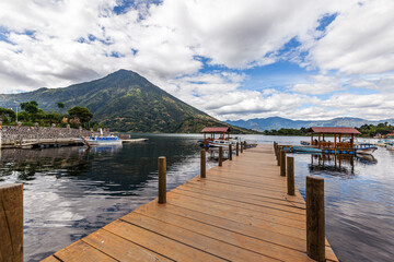 Beautiful panoramic view of Lake Santiago Atitlán and a wooden pier overlooking the San Pedro la...