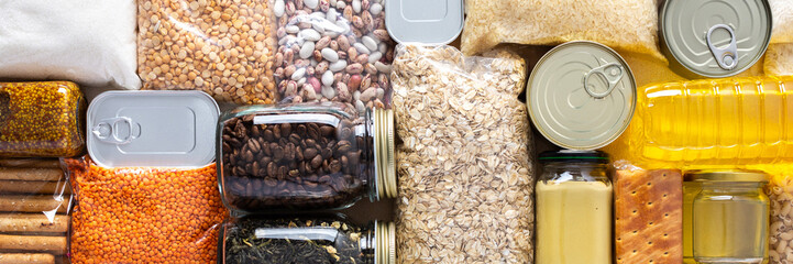 Home food supplies for quarantine and isolation, including canned food, cereals, pasta, and essential staples for survival, survival during military operations, the concept of stay at home, banner