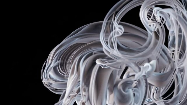 Swirling smoke creates mesmerizing patterns in a dark background