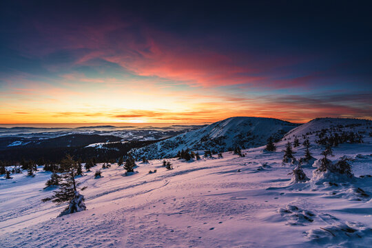 Winter colourful sunset in the snow-covered mountains of the Giant Mountains in the Czech Republic  - Powered by Adobe