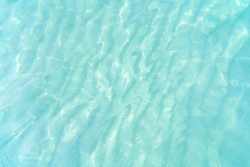 blue water surface with reflection and ripples