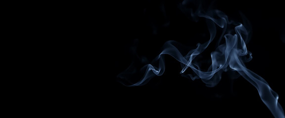 Abstract Blue Smoke Swirls Against Black Background