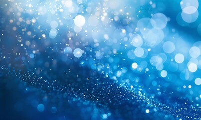 Soft bokeh lights in cool blues and silvers dissolve into a dark, tranquil gradient, evoking winter calm