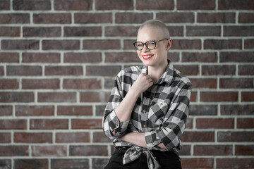 Portrait of a beautiful young caucasian woman with shaved head. Female cancer survivor. Smiling...