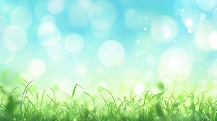 Obraz premium Beautiful sunny spring meadow with green grass and blue sky. Abstract background with light bokeh and space for text