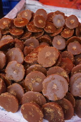 Organic date palm jaggery is being sold on the market, Organic Gur or Jaggery bar or cubes, Authentic sweet Jaggery cubes made with sugarcane,  Brown palm sugar jaggery