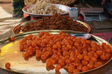 Fresh gulab jamun are being sold in a village fair, Making of Gulab Jamun in street side, delicious indian sweet gulab jamun 