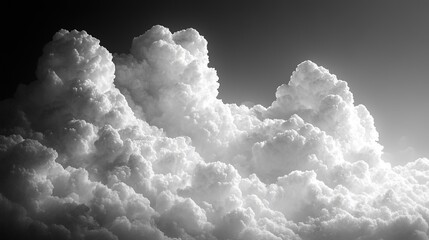 A dramatic black and white depiction of fluffy clouds, emphasizing texture and depth in the sky.