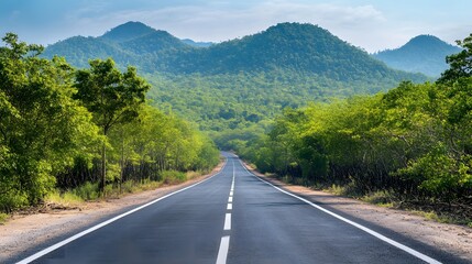 Obraz premium Scenic Highway Winding Through Lush Green Mountains