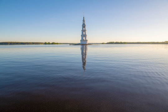 Landscape of Uglich Reservoir with bell tower of flooded Nikolsky Cathedral on a sunny May morning. Kalyazin. Tver Oblast, Russia