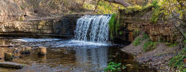Panorama of Sablinsky waterfall on a sunny October day. Leningrad region, Russia