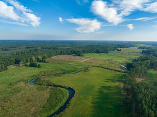 Aerial viev rural landscape and Ina river near Puszcza Goleniowska in West Pomerania, region of Poland. Photo from the drone.	
