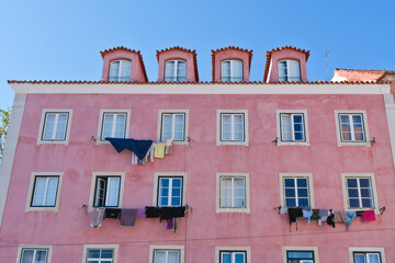 Pink apartment building in old town of Alfama Lisbon Portugal 