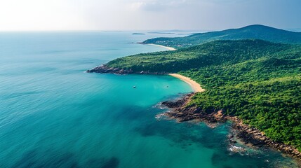 Obraz premium Secluded tropical beach coastline with lush green hills