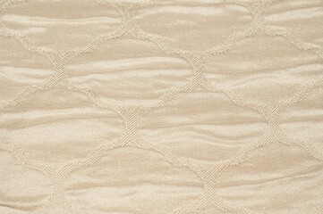 Creative background made of silk fabric with beige pattern