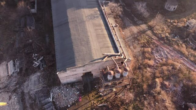 Aerial view of an abandoned Soviet era factory in Tbilisi, Georgia. Debris scattered around due to ongoing demolition of the nearby factories and buildings.