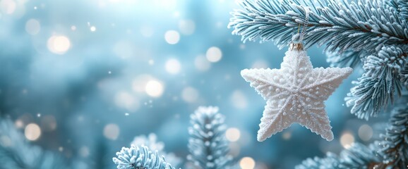 Frosty white star ornament hanging on a snow-covered pine branch with bokeh lights.