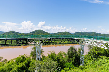 Fototapeta premium A beautiful bridge or glass skywalk over Mekong river, a tourist destination located between Thailand and Laos PDR at Chiang Khan, Loei Province
