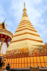 PHRAE, THAILAND - 28 September 2022 : Wat Phra Tat Chorhae golden pagoda, the most famous temple in Phrae in Northern part of Thailand.