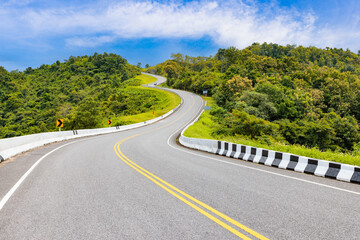 Popular view point of double s-curve road up to the hill with green tree and sky, called curve number 3 at Nan province, Northern of Thailand