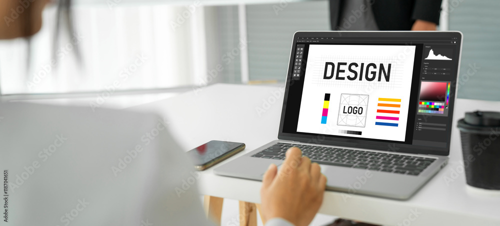 Poster graphic designer software for modern design of web page and commercial ads showing on the computer s