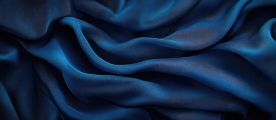 Fototapeta premium Elegant Deep Blue Fabric Texture with Soft Drapes and Ample Copyspace for Creative Text or Branding Needs
