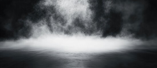 Dark gray abstract background with fog creating a serene atmosphere and ample blank space for text or graphic overlay