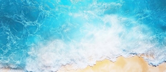 Aerial view of tranquil light blue ocean and sky with sandy beach creating a serene backdrop for text or graphic overlay