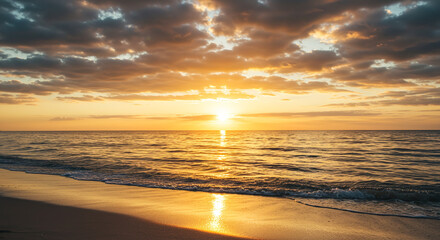 A majestic sunset seen from the beach with a calm sea