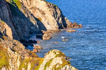 Breathtaking aerial view of Point Reyes, California, showcasing dramatic coastal cliffs surrounded...