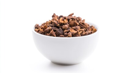 Obraz premium Dried clove or he aromatic flower buds of Syzygium aromaticum, spice from Indonesia. In a small white bowl. Isolated on white background