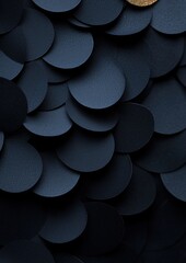 A close up of a black and gold pattern of circles