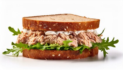 tuna salad sandwich with lettuce and arugula on whole grain bread isolated on white background